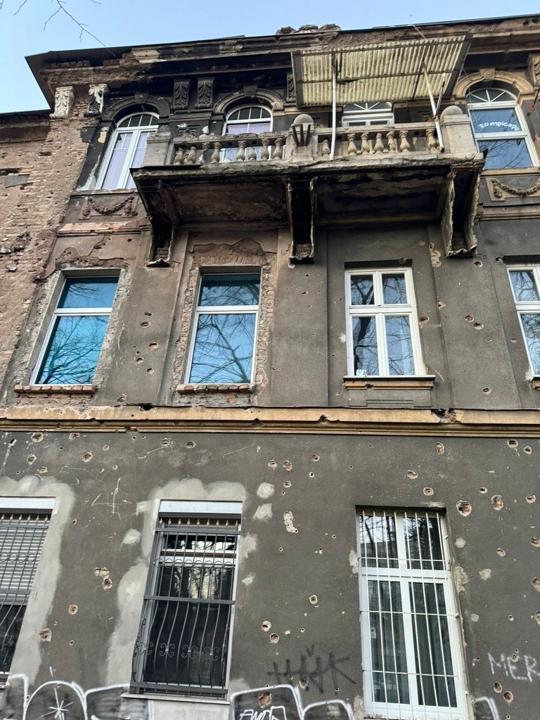 That sure is a lot of bullet holes on this building. That can't have been good.