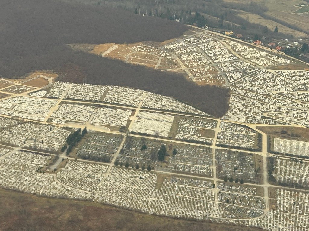 Flying into Sarajevo, the mood is set by looking down on the cemetaries full of people killed during ethnic cleansing.